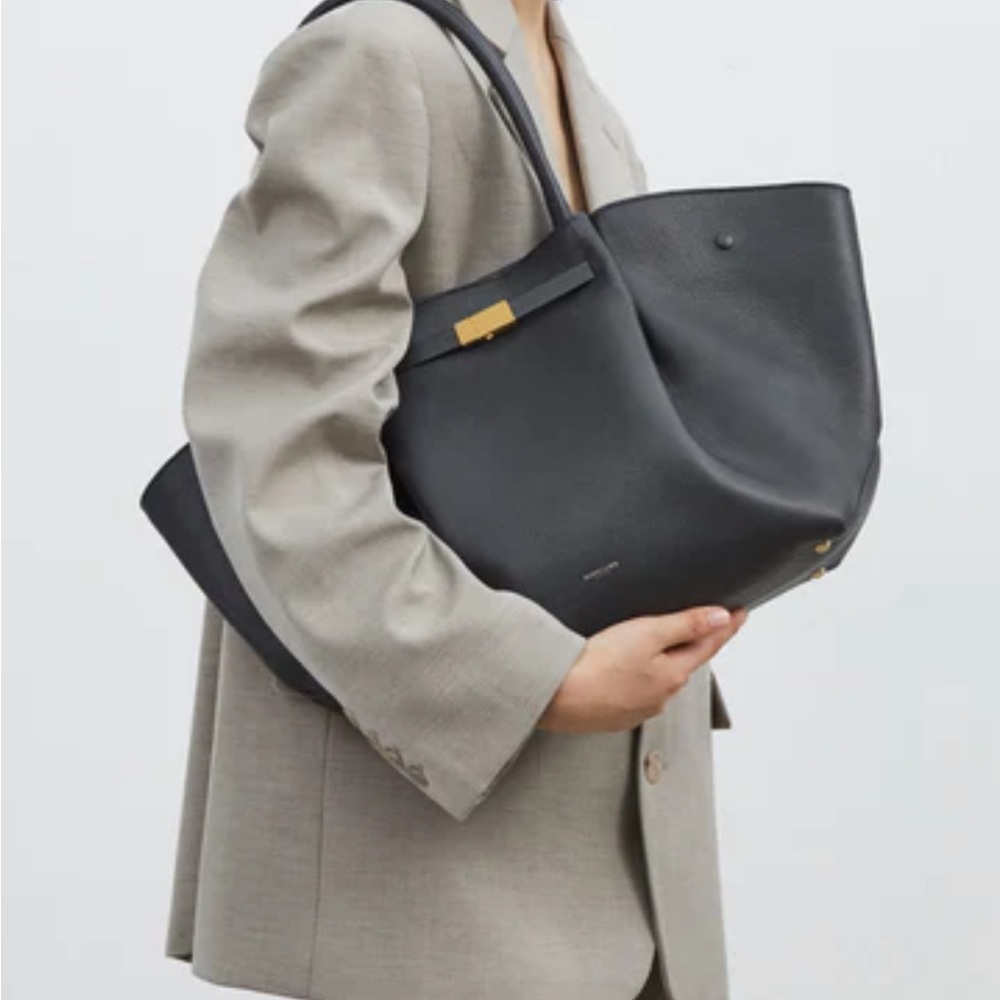 Demellier (always sold out) black with gold tote leather bag. NEW with dust bag